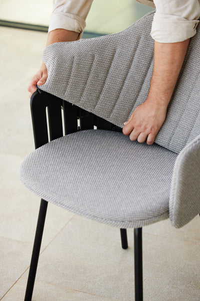 Choice 4 Legs Outdoor Chair by Cane-Line, showing closeup view of choice 4 legs outdoor chair in live shot.