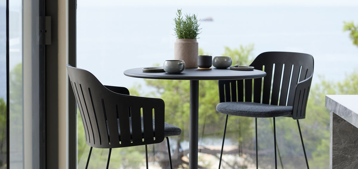 Choice Sled Bar Chair by Cane-Line, showing closeup view of choice sled bar chairs in live shot.