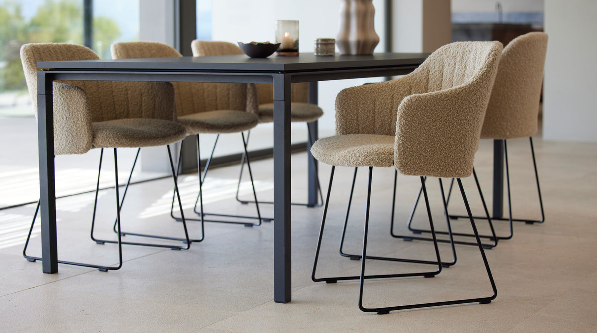 Choice Sled Chair by Cane-Line, showing choice sled chairs in live shot.