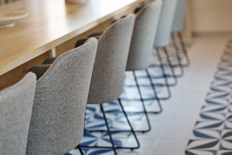 Choice Sled Chair by Cane-Line, showing choice sled chairs in live shot.