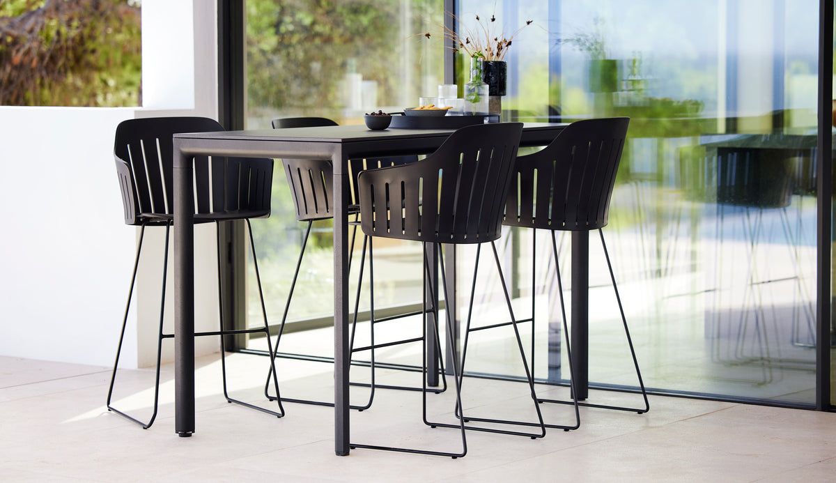 Choice Sled Outdoor Bar Chair by Cane-Line, showing choice sled outdoor bar chairs in live shot.