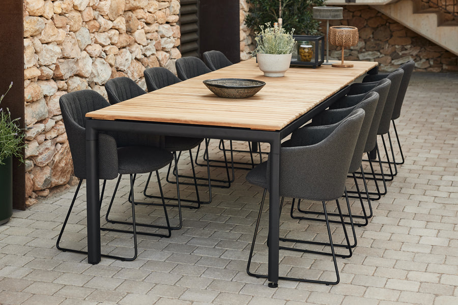 Choice Sled Outdoor Chair by Cane-Line, showing choice sled outdoor chairs in live shot.