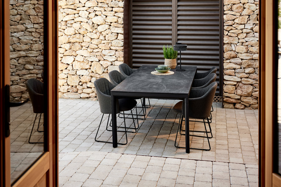 Choice Sled Outdoor Chair by Cane-Line, showing choice sled outdoor chairs in live shot.