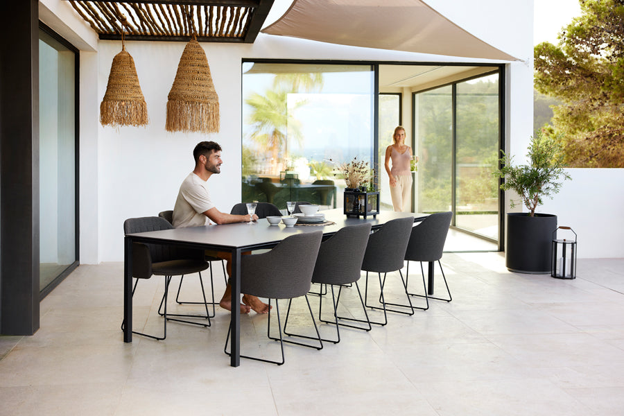 Choice Sled Outdoor Chair by Cane-Line, showing choice sled outdoor chairs in live shot.