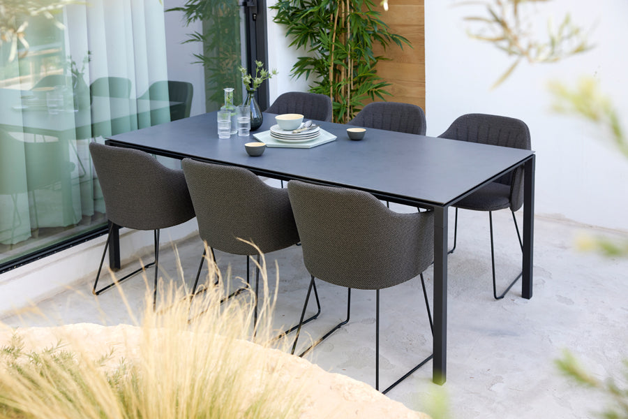 Choice Sled Outdoor Chair by Cane-Line, showing choice sled outdoor chairs in live shot.
