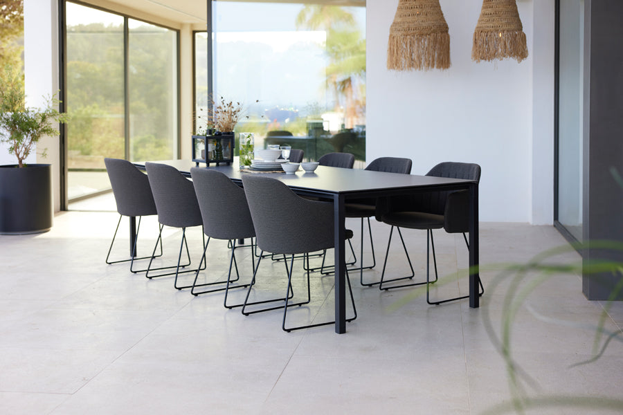 Choice Sled Outdoor Chair by Cane-Line, showing choice sled outdoor chairs in live shot.