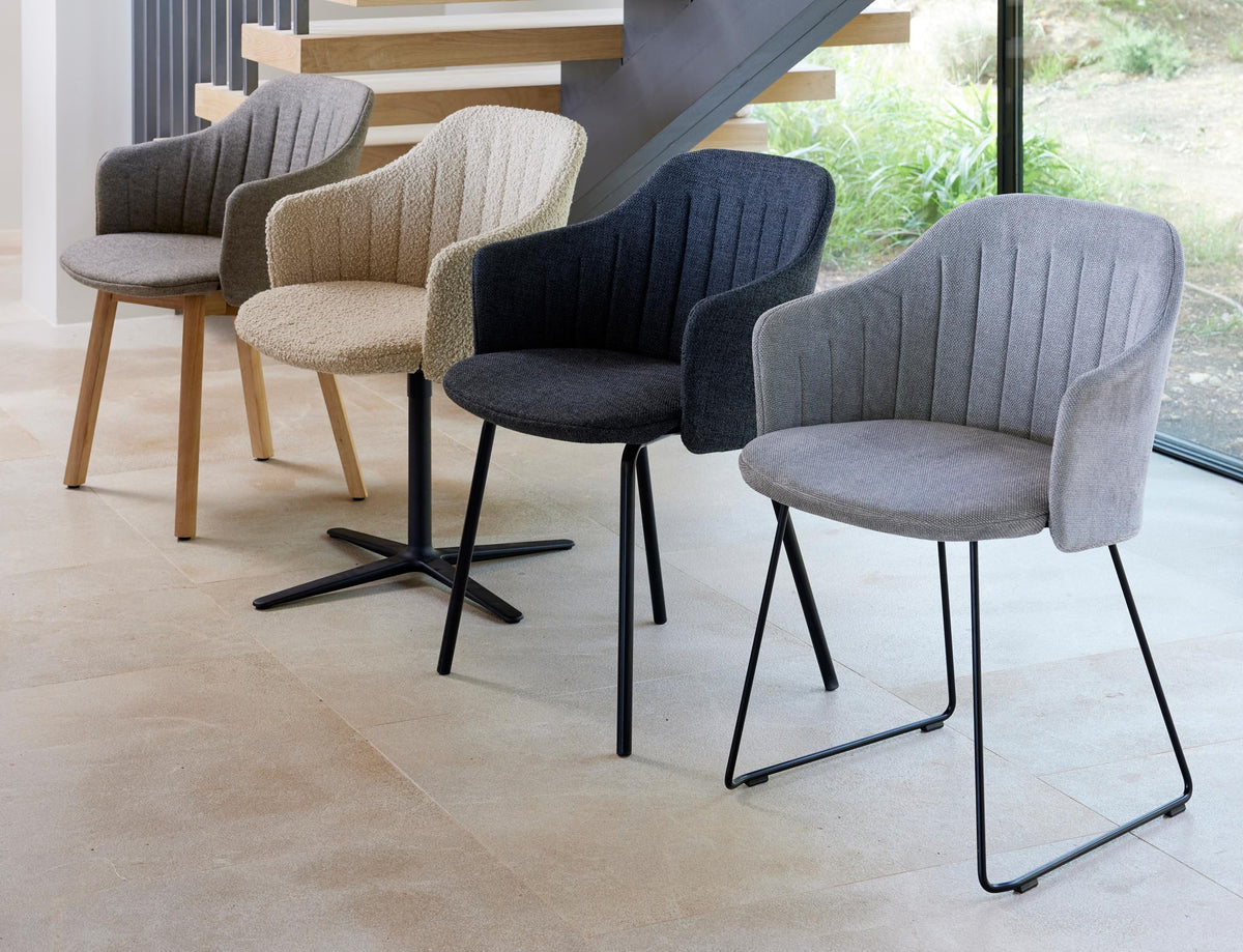 Choice Swivel Chair by Cane-Line, showing choice swivel chair in live shot.