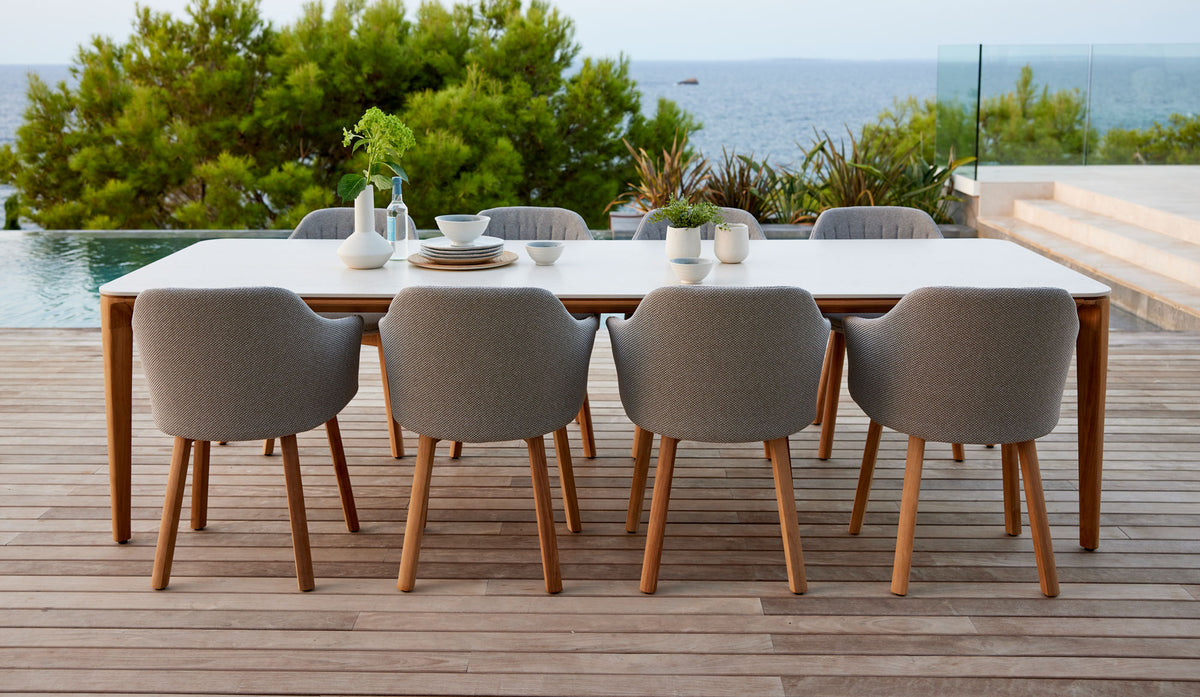 Choice Wood Chair by Cane-Line, showing choice wood chairs in live shot.