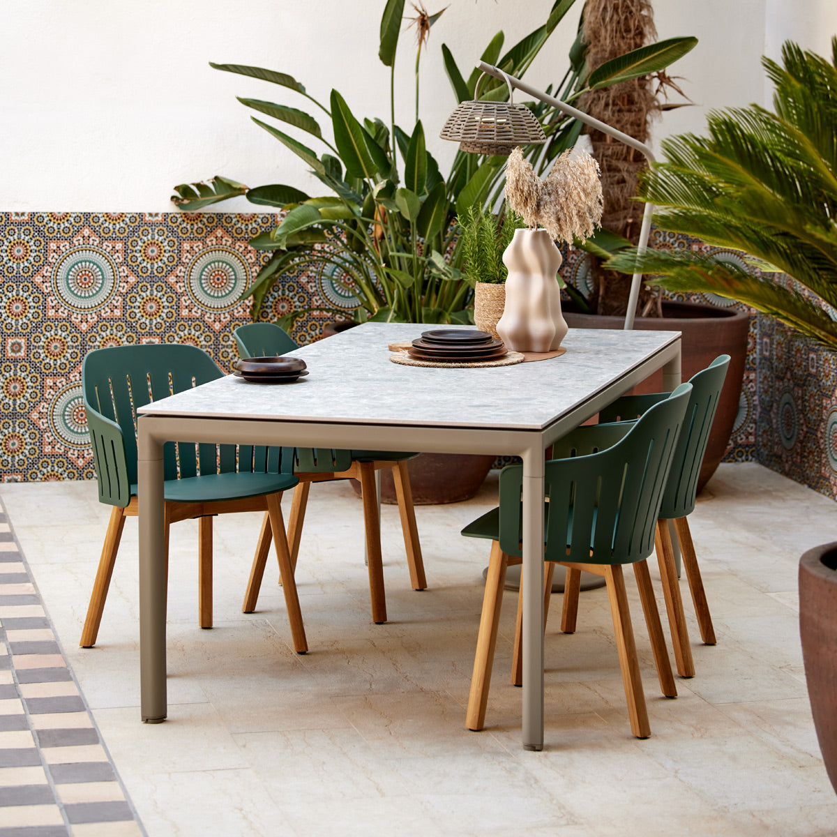 Choice Wood Chair by Cane-Line, showing choice wood chairs in live shot.
