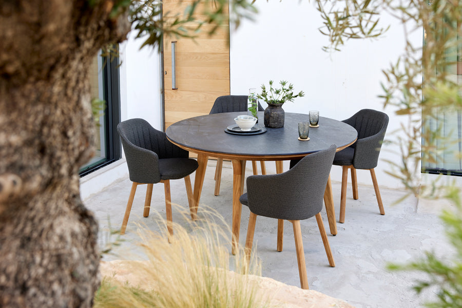 Choice Wood Chair by Cane-Line, showing choice wood chairs in live shot.