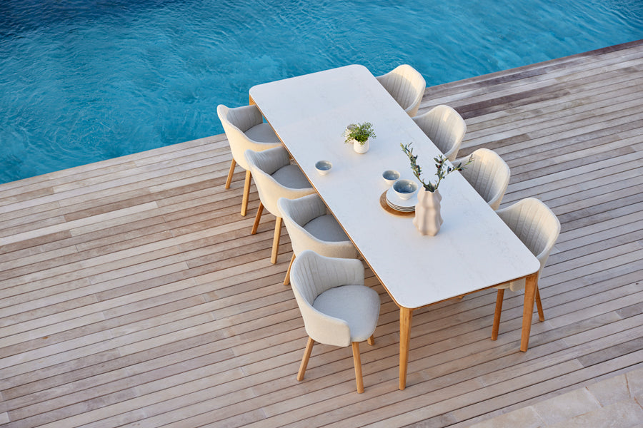 Choice Wood Chair by Cane-Line, showing choice wood chairs in live shot.