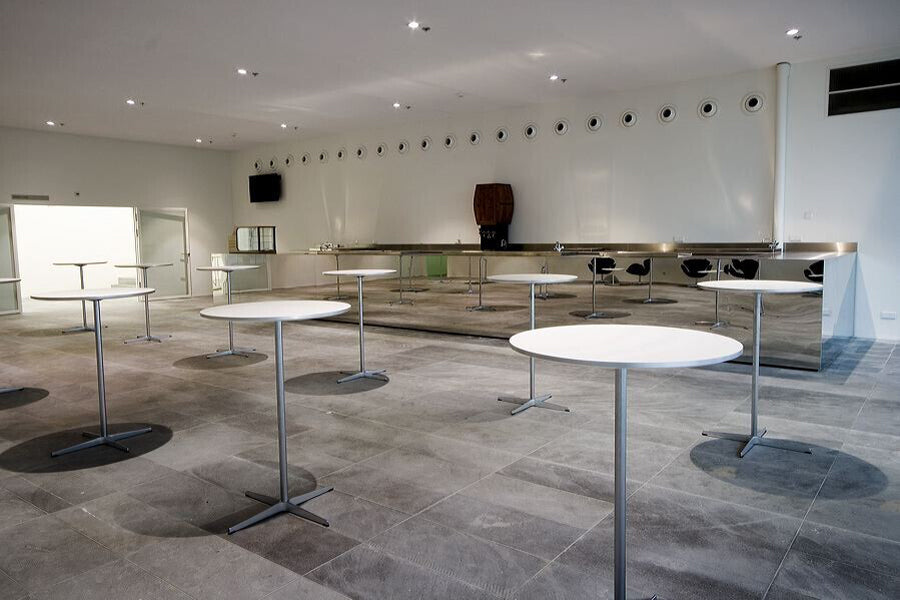 Circular Bar Table by Fritz Hansen, showing circular bar tables in live shot.
