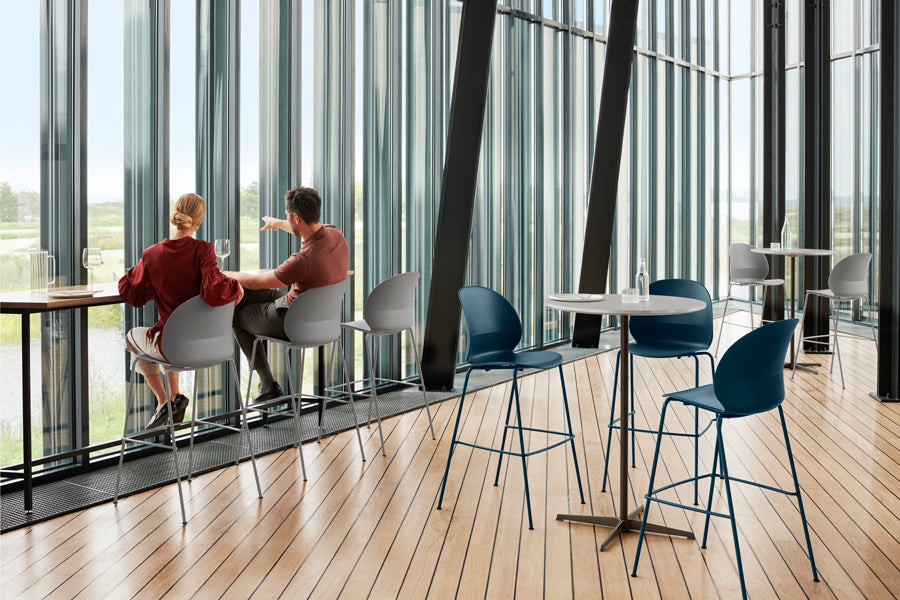 Circular Bar Table by Fritz Hansen, showing circular bar tables in live shot.