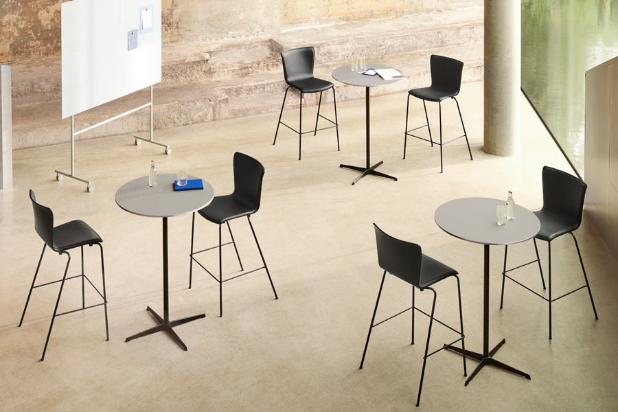 Circular Bar Table by Fritz Hansen, showing circular bar tables in live shot.