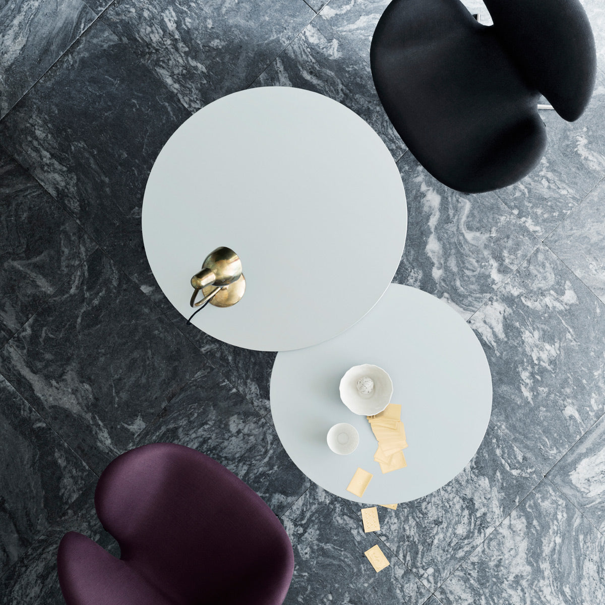 Circular Coffee Table by Fritz Hansen, showing circular coffee tables in live shot.