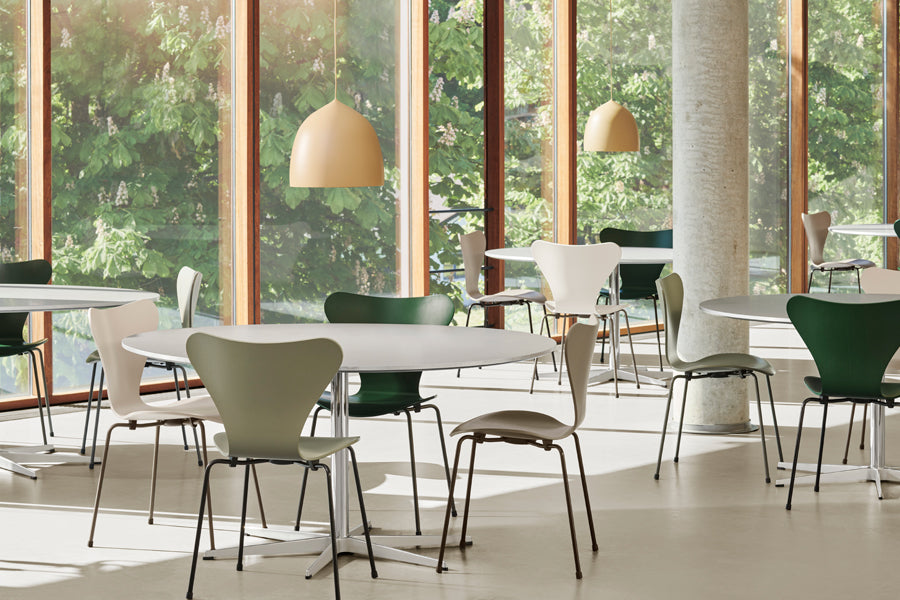 Circular Table by Fritz Hansen, showing circular tables in live shot.