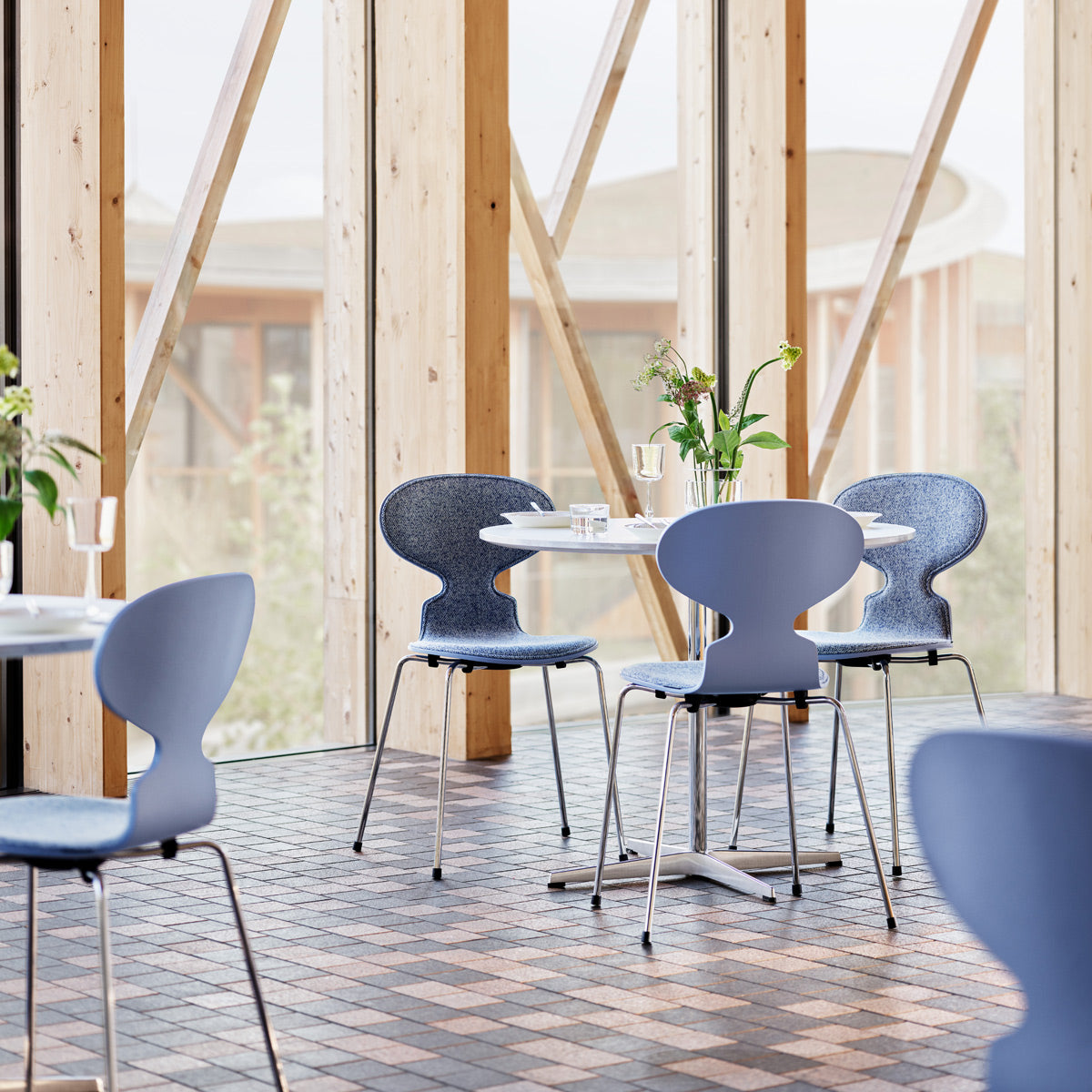 Circular Table by Fritz Hansen, showing circular tables in live shot.