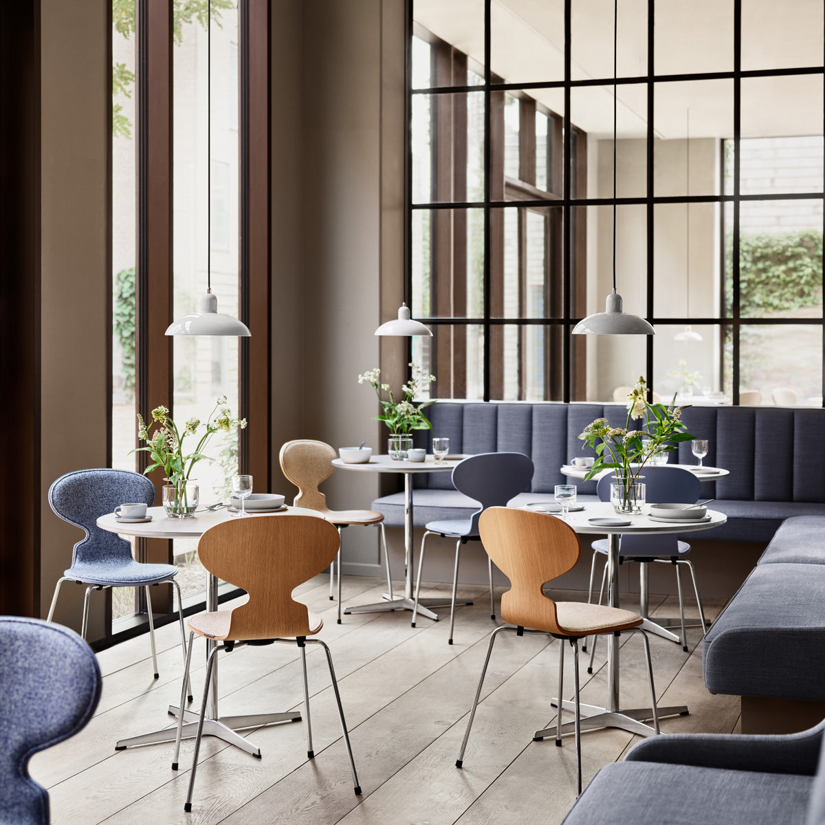 Circular Table by Fritz Hansen, showing circular tables in live shot.