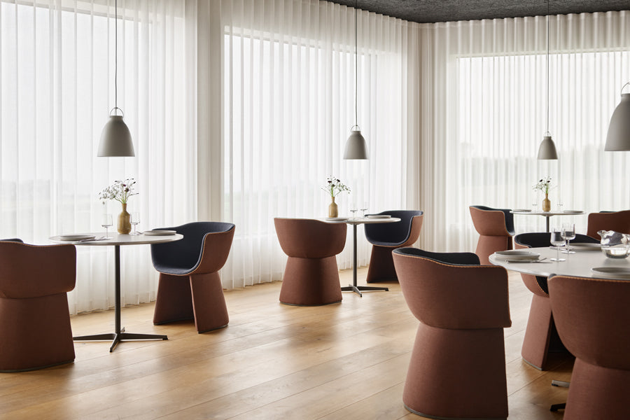 Circular Table by Fritz Hansen, showing circular tables in live shot.