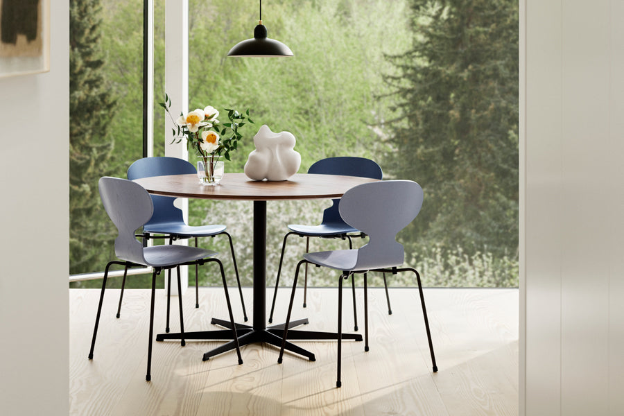 Circular Table by Fritz Hansen, showing circular table in live shot.