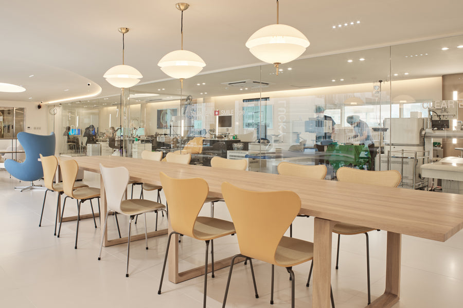 Clam Pendant by Fritz Hansen, showing clam pendants in live shot.