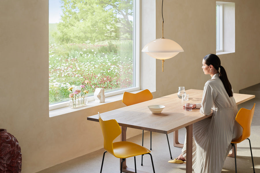Clam Pendant by Fritz Hansen, showing clam pendant in live shot.