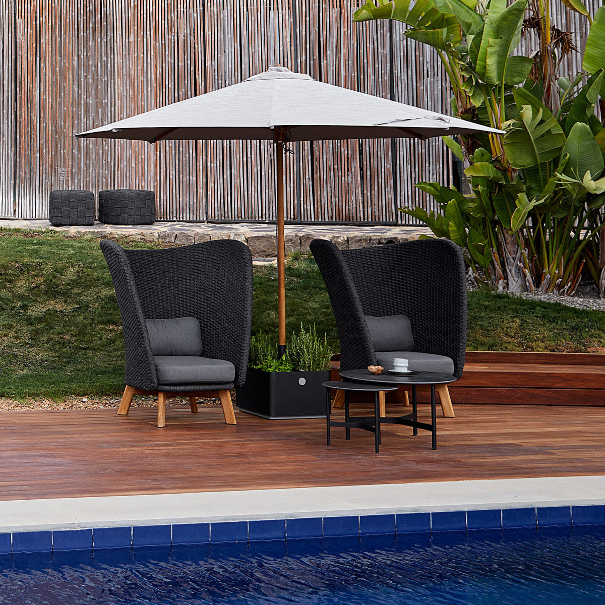 Classic Parasol with Pulley System by Cane-Line, showing classic parasol with pulley system in live shot.