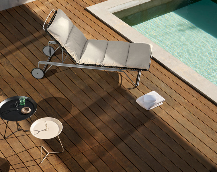 Click Adjustable Chaise Sunlounger by Houe, showing click adjustable chaise sunlounger in live shot.