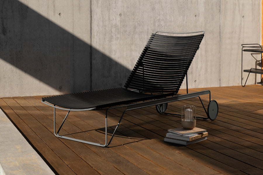 Click Adjustable Chaise Sunlounger by Houe, showing click adjustable chaise sunlounger in live shot.