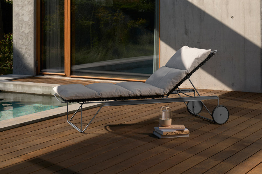 Click Adjustable Chaise Sunlounger by Houe, showing click adjustable chaise sunlounger in live shot.
