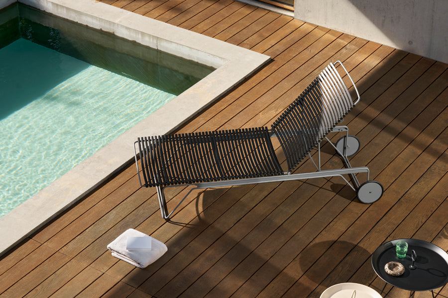 Click Adjustable Chaise Sunlounger by Houe, showing click adjustable chaise sunlounger in live shot.
