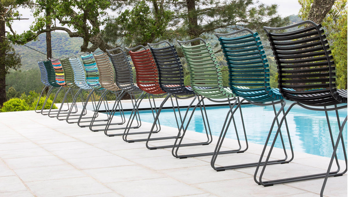 Click Dining Chair by Houe, showing click dining chairs in live shot.