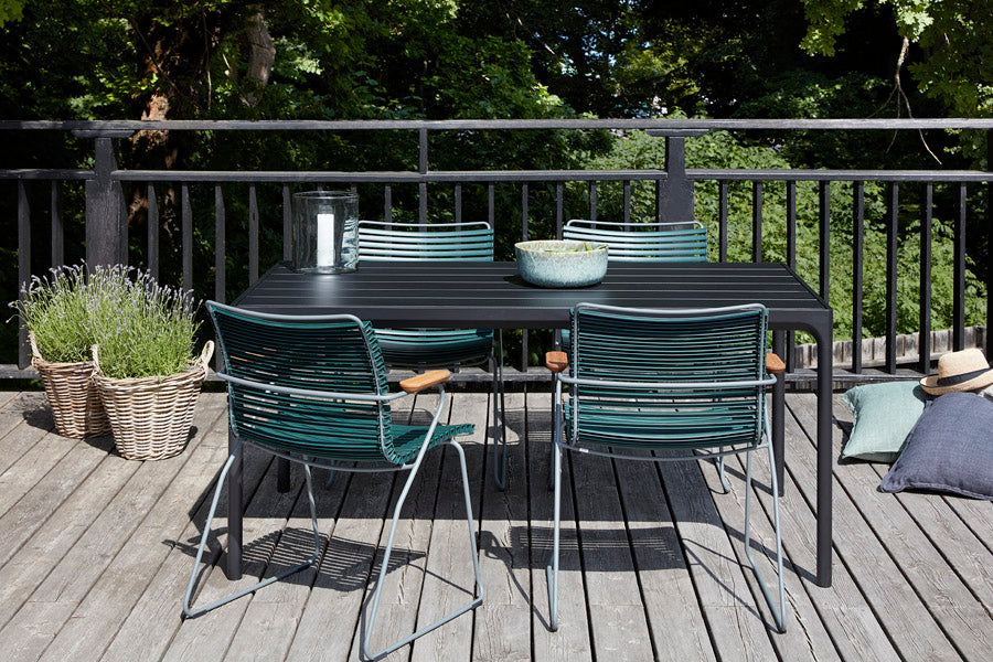 Click Dining Chair by Houe, showing click dining chairs in live shot.