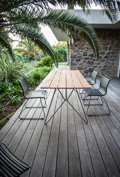 Click Dining Chair by Houe, showing click dining chairs in live shot.