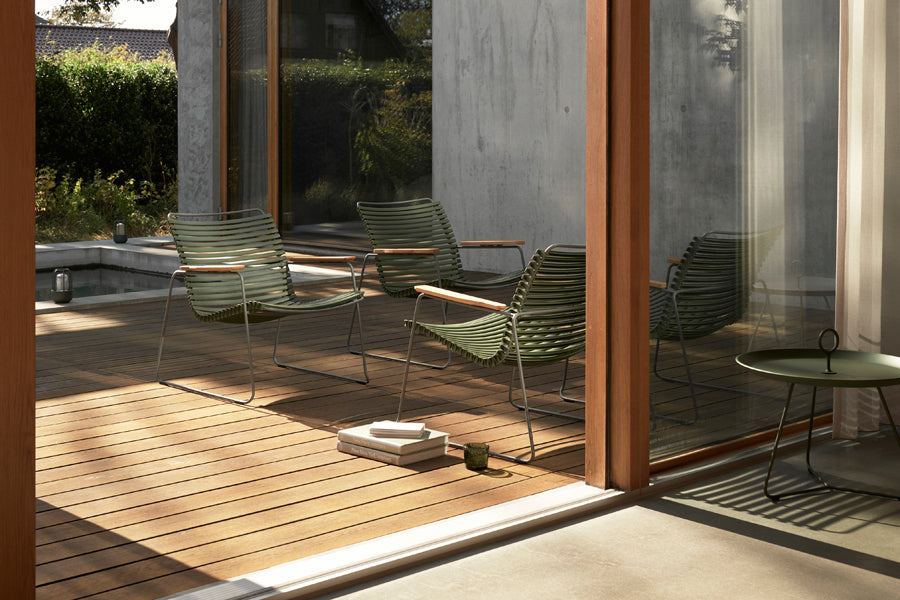 Click Roomy Lounge Chair by Houe, showing click roomy lounge chairs in live shot.