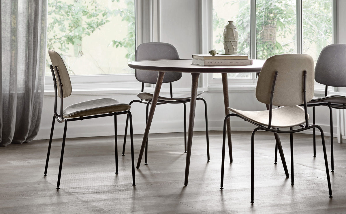 Compound Dining Chair by Mater, showing compound dining chairs in live shot.