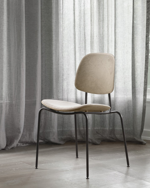 Compound Dining Chair by Mater, showing compound dining chair in live shot.