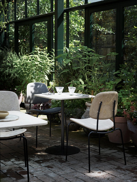Compound Dining Chair by Mater, showing compound dining chairs in live shot.
