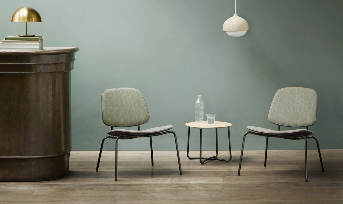 Compound Lounge Chair by Mater, showing compound lounge chairs in live shot.