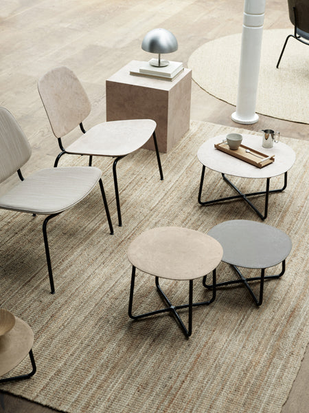 Compound Lounge Chair by Mater, showing compound lounge chairs in live shot.