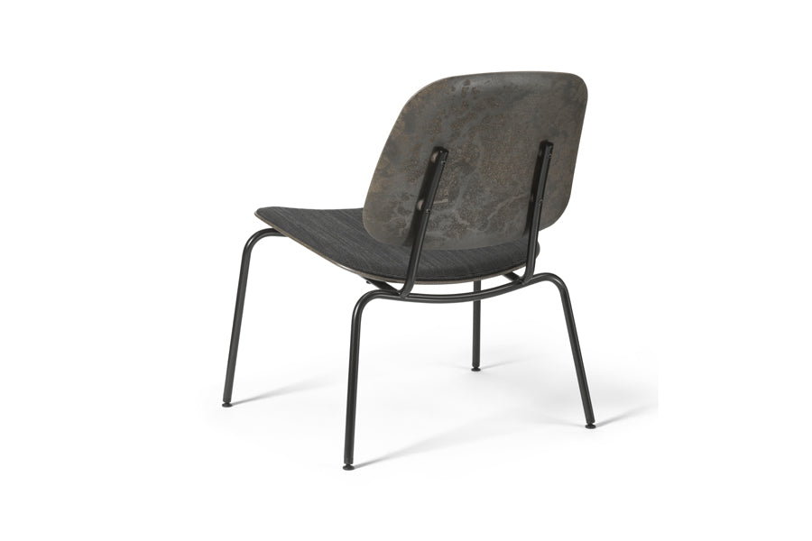 Compound Lounge Chair by Mater, showing back view of compound lounge chair in black coffee waste.