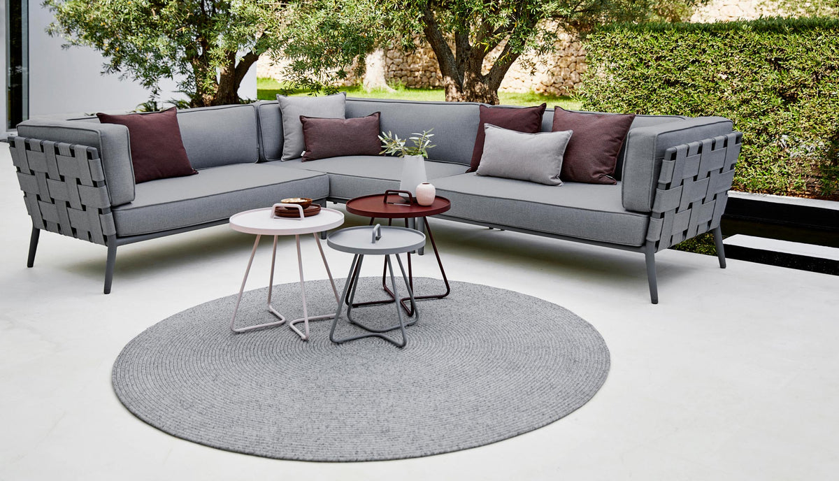 Conic Lounge Configuration 1 by Cane-Line, showing conic lounge configuration 1 in live shot.