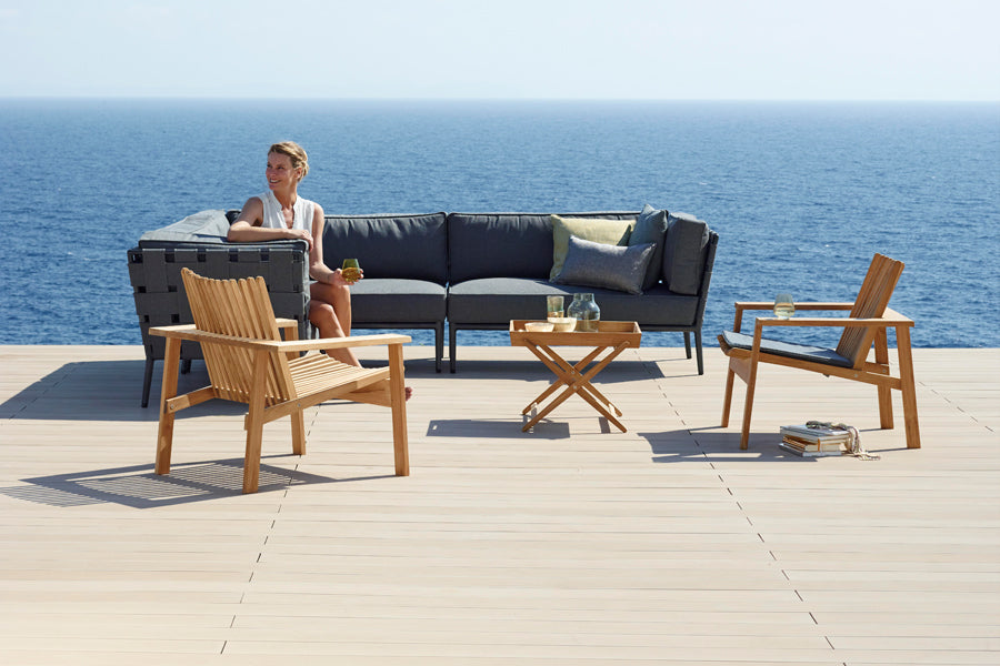 Conic Lounge Configuration 1 by Cane-Line, showing conic lounge configuration 1 in live shot.