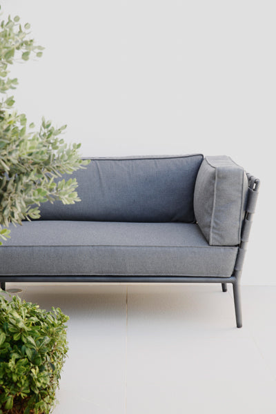 Conic Lounge Configuration 1 by Cane-Line, showing closeup view of conic lounge configuration 1 in live shot.