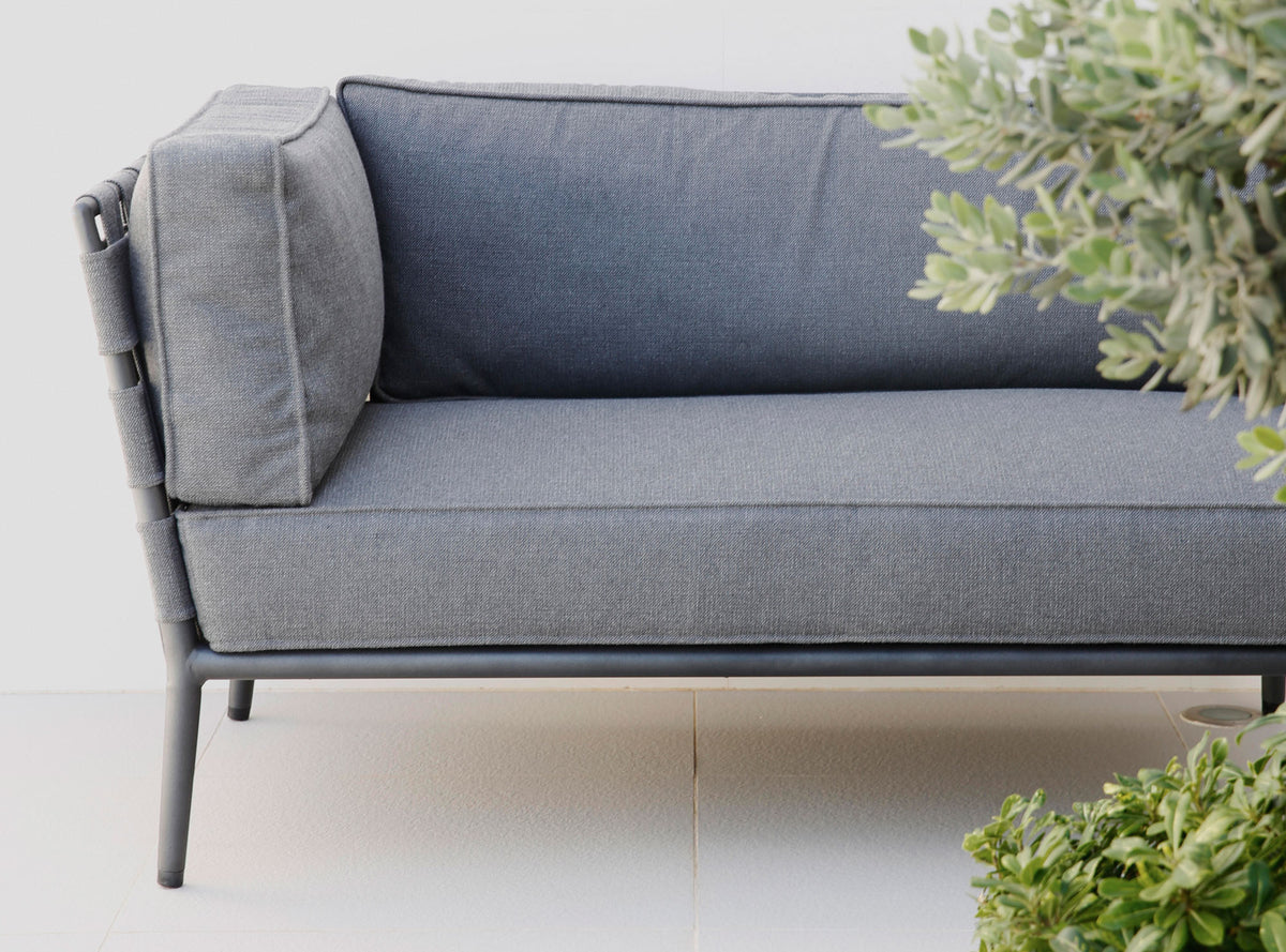 Conic Lounge Configuration 3 by Cane-Line, showing closeup view of conic lounge configuration 3 in live shot.