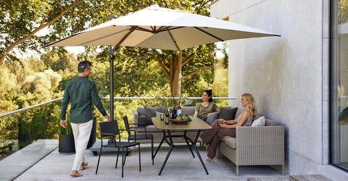 Connect Outdoor Dining Lounge by Cane-Line, showing connect outdoor lounges in live shot.