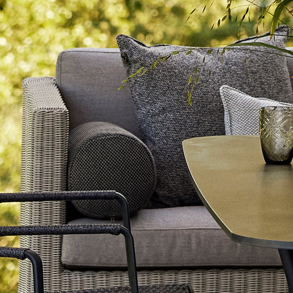 Connect Outdoor Dining Lounge by Cane-Line, showing closeup view of connect outdoor lounge in live shot.