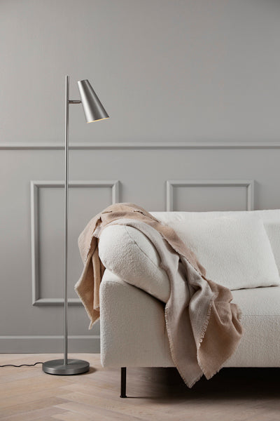 Cono Floor Lamp by Woud, showing cono floor lamp in live shot.