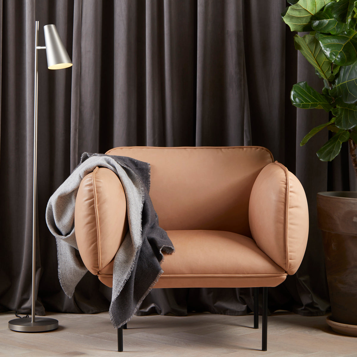 Cono Floor Lamp by Woud, showing cono floor lamp in live shot.