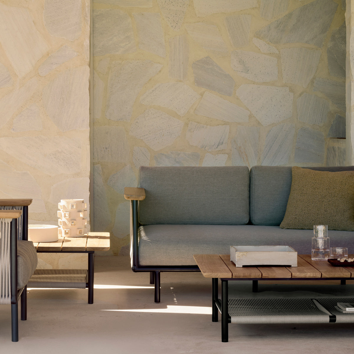 Corbey Outdoor Coffee Table by Ethnicraft, showing closeup view of corbey outdoor coffee tables in live shot.